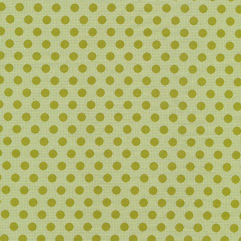 Mint green fabric with dark green polka dots all over