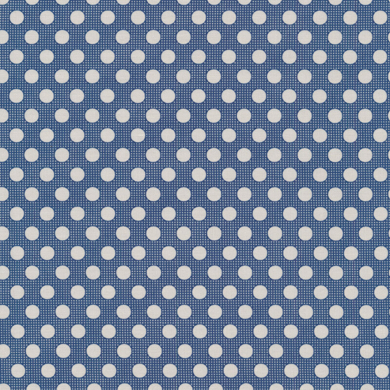 Dark blue sewing fabric with white polka dots all over
