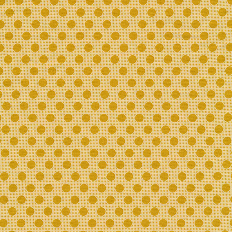 Yellow sewing fabric with dark yellow polka dots all over