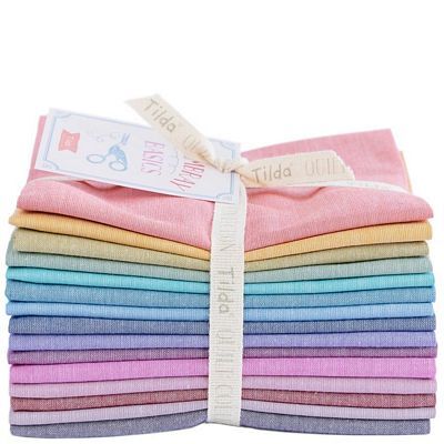 pastel colored Chambray fabric in a stack tied with a ribbon and label