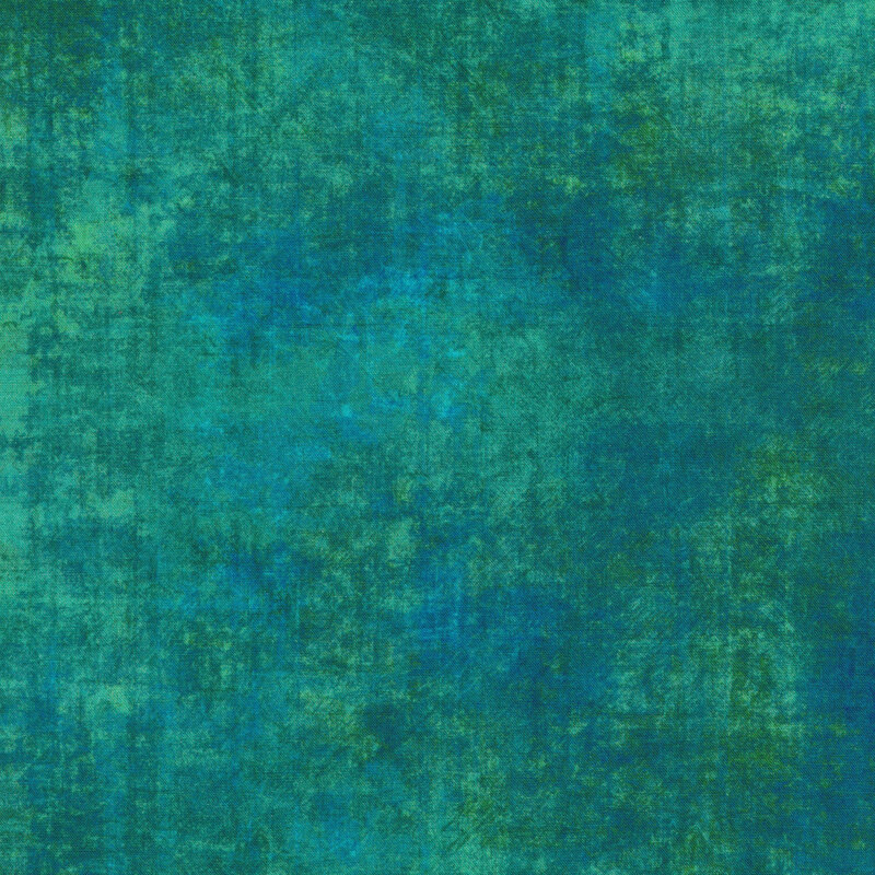 A mottled teal fabric with a grunge texture look with bits of bright blue mottling