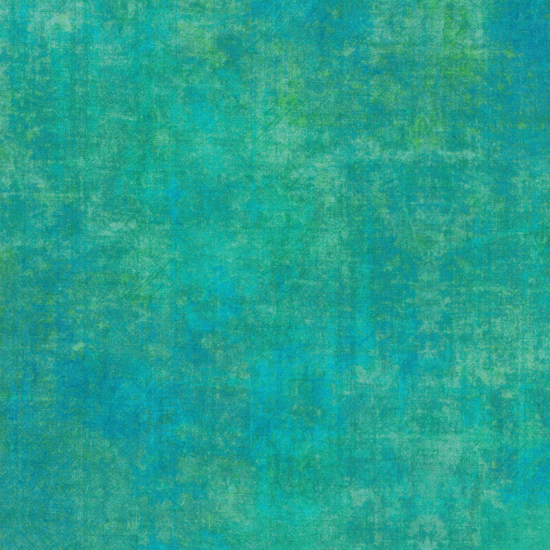 A mottled aqua fabric with a grunge texture look with bits of green mottling