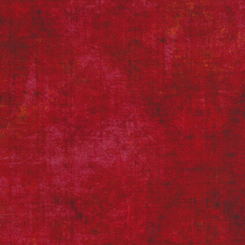 A scarlet red textured fabric with mottling