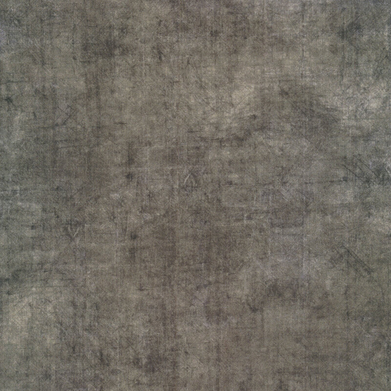 A gray textured fabric with mottling