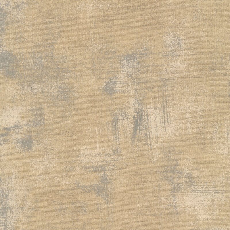 Tan fabric with bits of black and cream grunge texturing