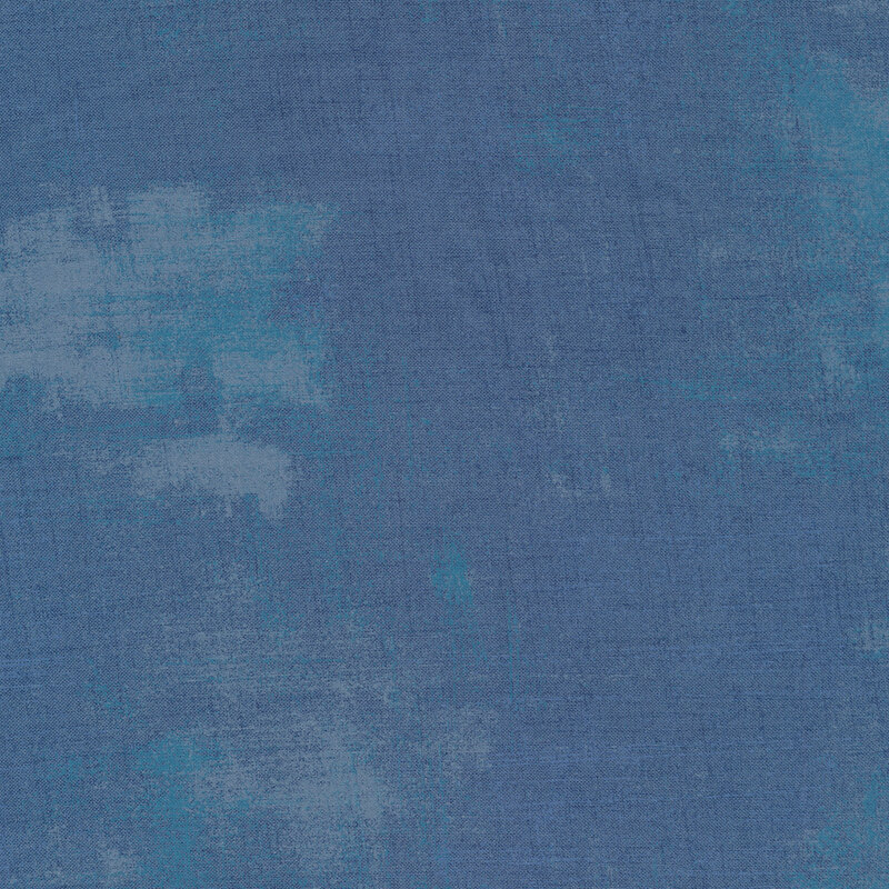 Blue fabric with bits of light blue grunge texturing