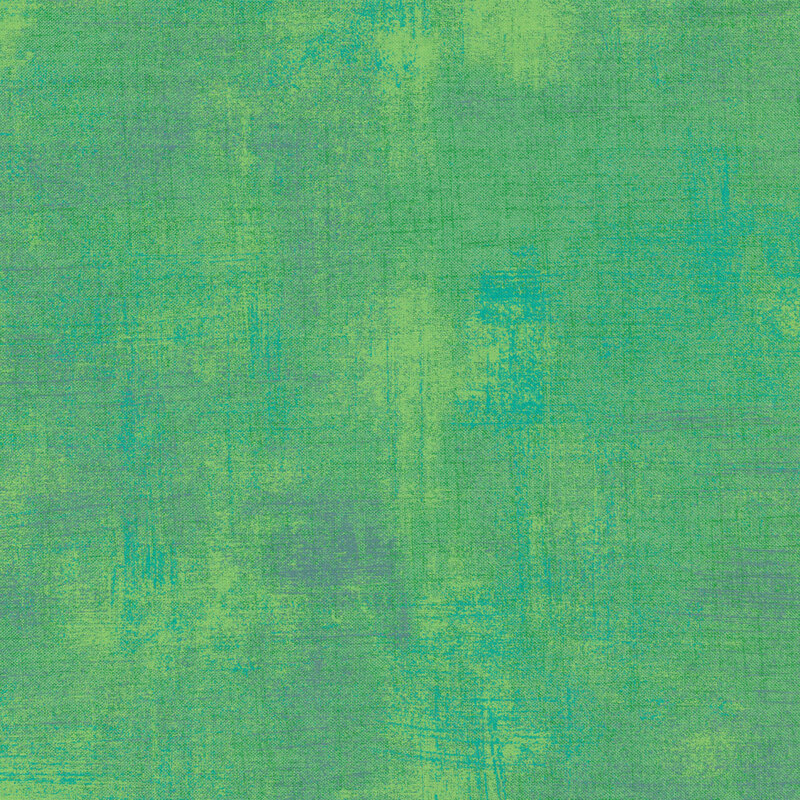 Jade green fabric with bits of light teal and grey grunge texturing