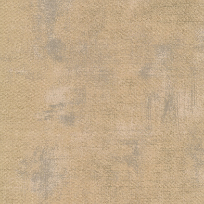 Tan fabric with bits of grey grunge texturing