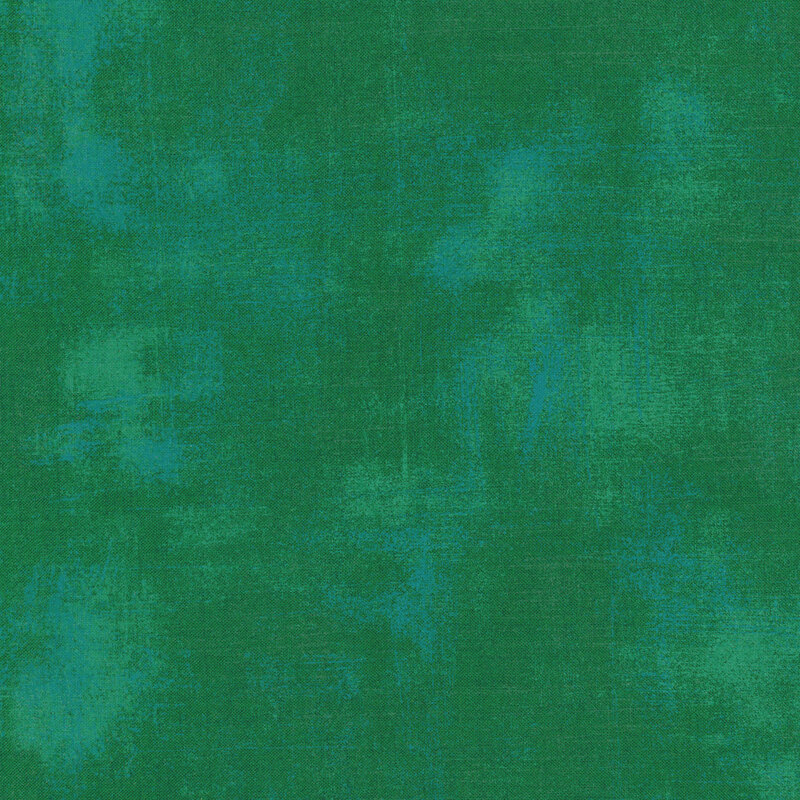 Dark green fabric with bits of teal grunge texturing