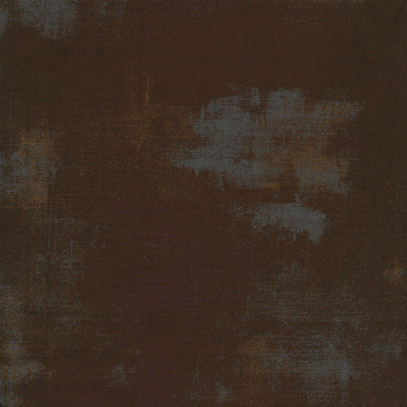 Dark brown fabric with bits of light grey grunge texturing