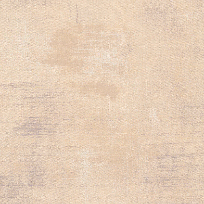 Taupe fabric with bits of light brown and grey grunge texturing