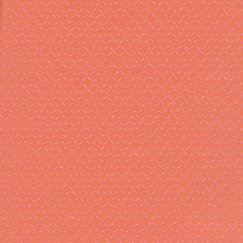 Peach fabric with an iridescent geometric design