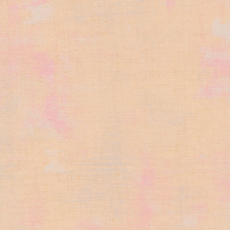 Light peach fabric with bits of pink grunge texturing