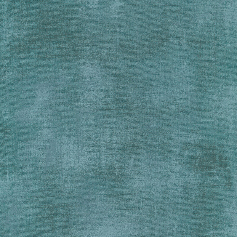 Pale teal fabric with bits of mottled grunge texturing