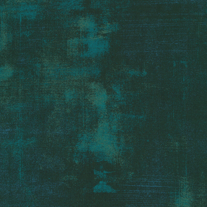 Deep teal fabric with bits of mottled grunge texturing