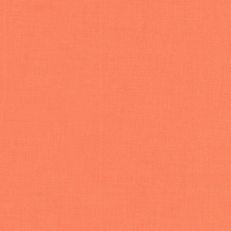 A solid bright coral fabric