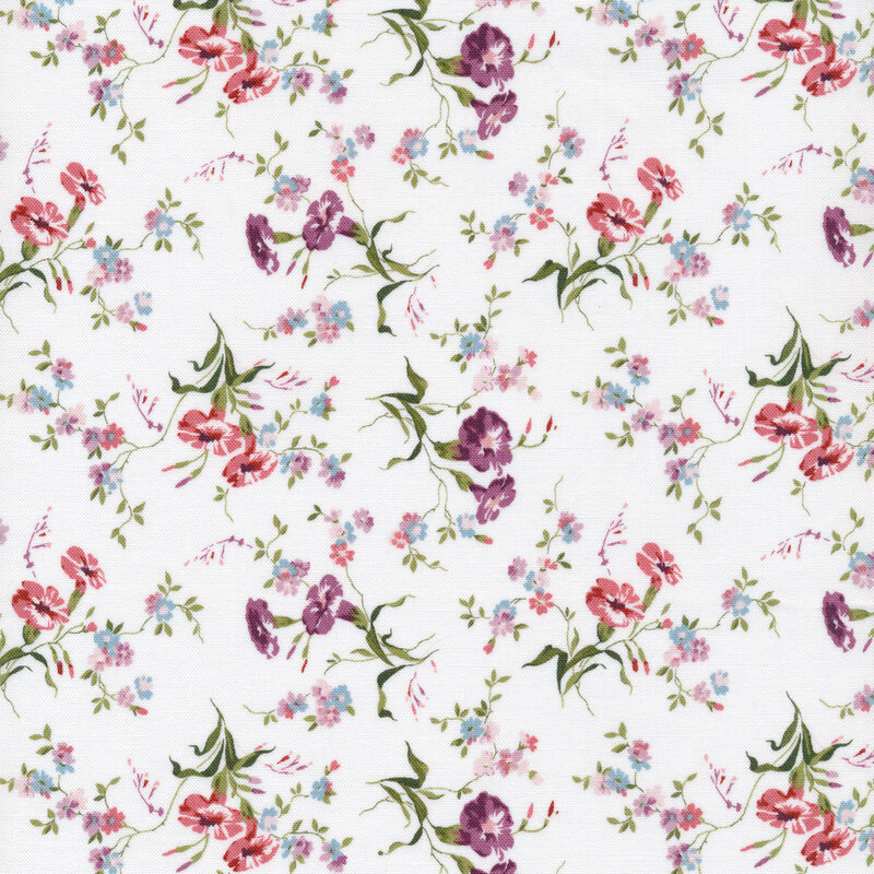 Fabric that has tossed florals with green leaves on a white background