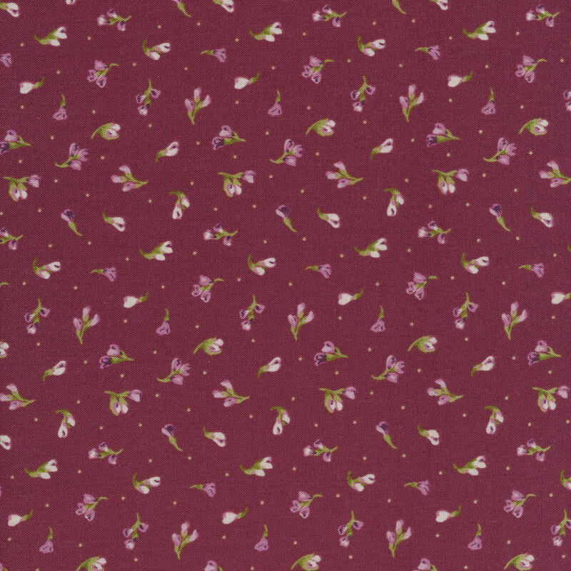 Fabric that has tossed florals with pink leaves on a purple background
