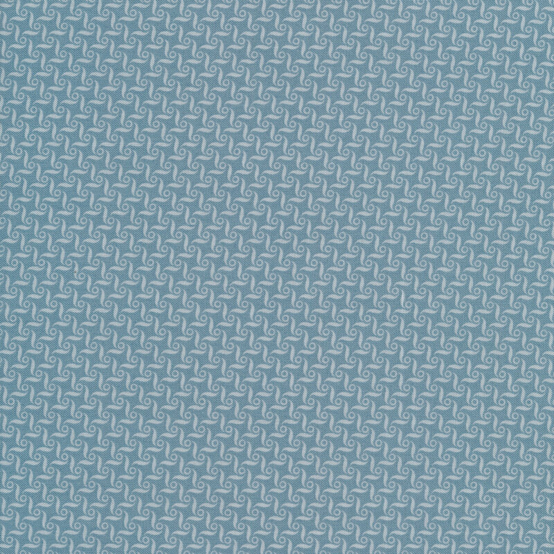Tonal blue fabric featuring a connected swirl pattern
