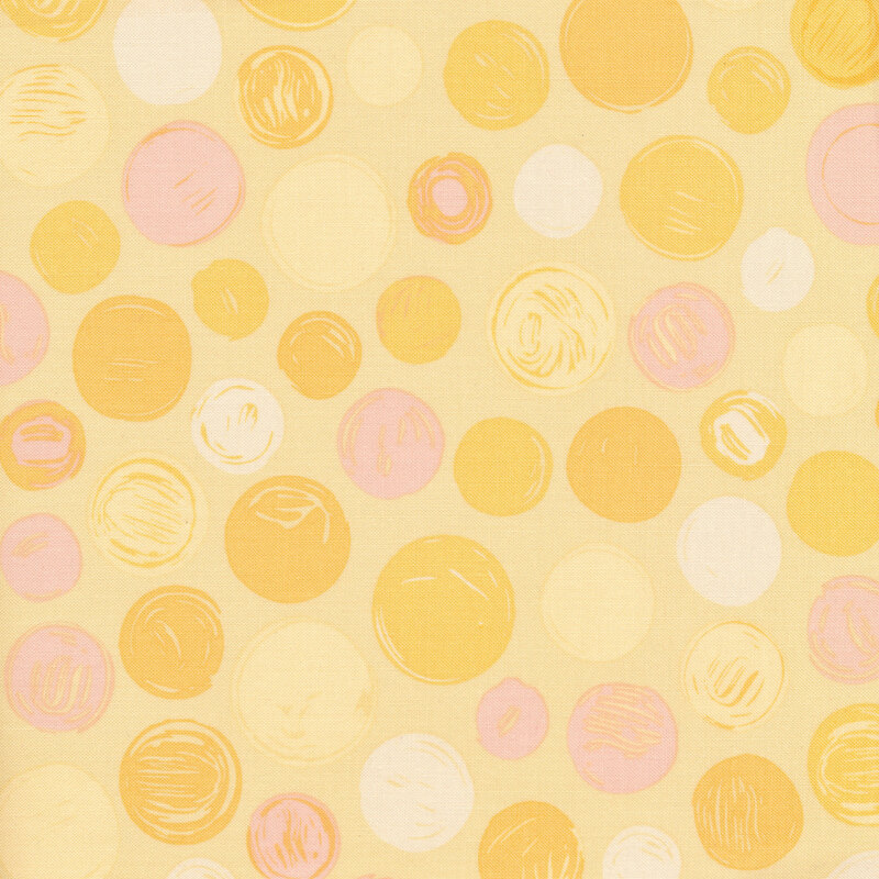 Yellow fabric with light yellow, gold, and light pink polka dots of varying sizes