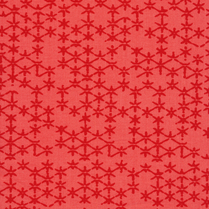 Bright coral fabric with tonal distressed stars all over