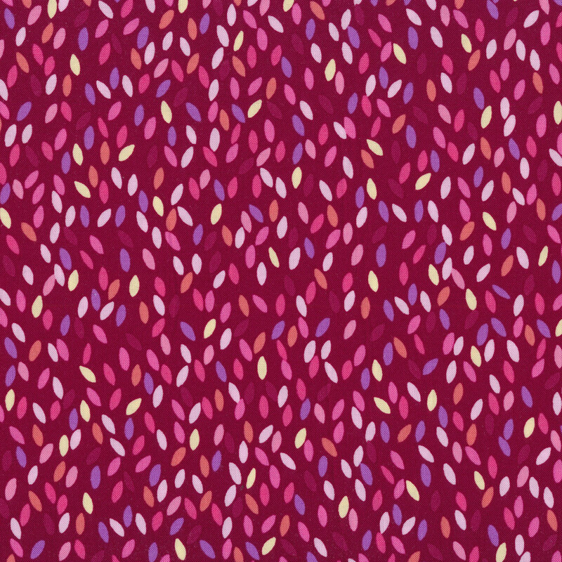 Burgundy red fabric with colorful flower petals all over