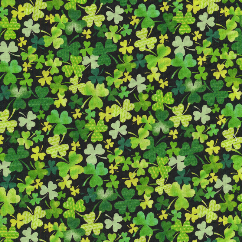 packed shamrocks and clovers with subtle knit pattern on a black background