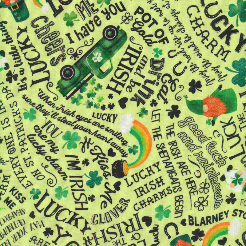 Light green fabric with gnomes, trucks, clovers, shamrocks, and words all over