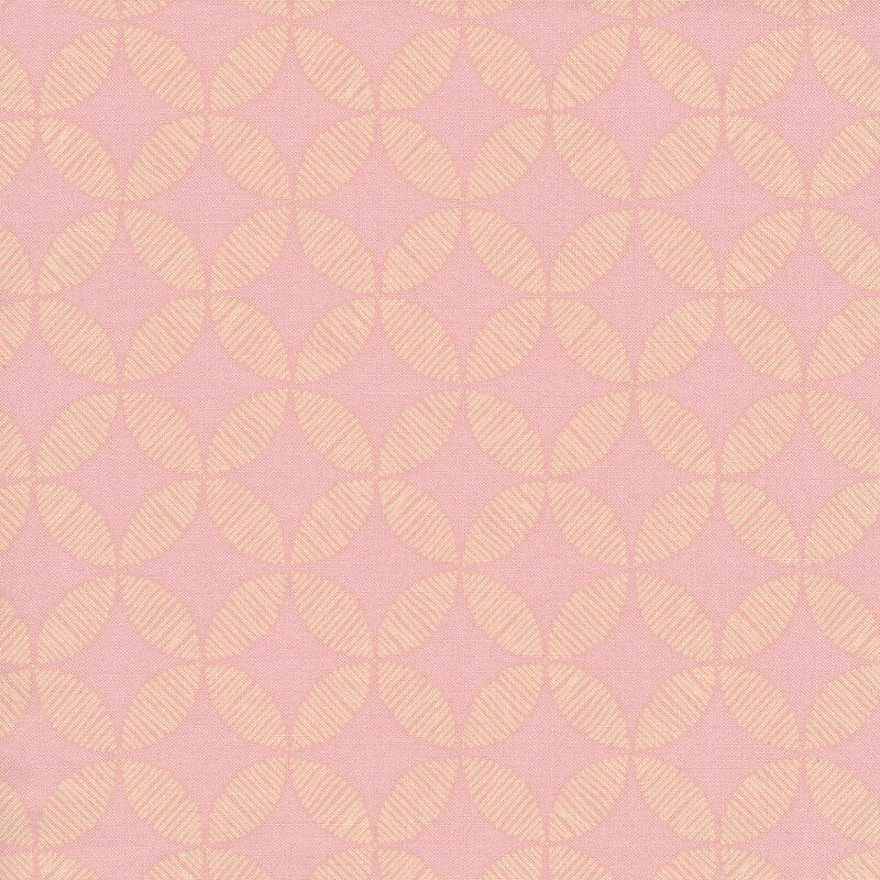 Light pink tonal fabric with cathedral window designs