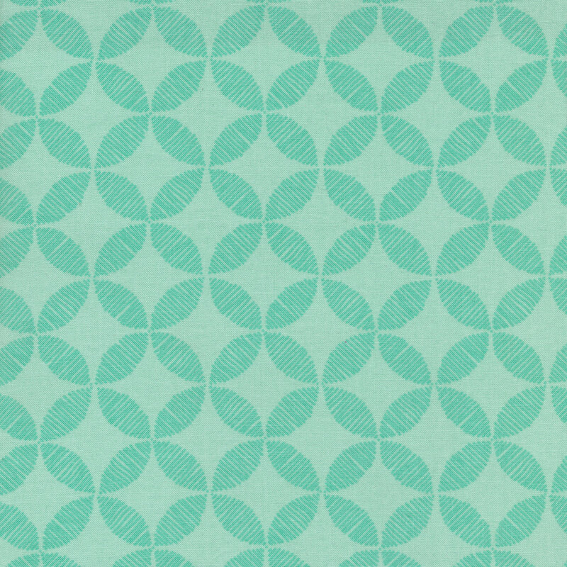 Bright aqua tonal fabric with cathedral window designs