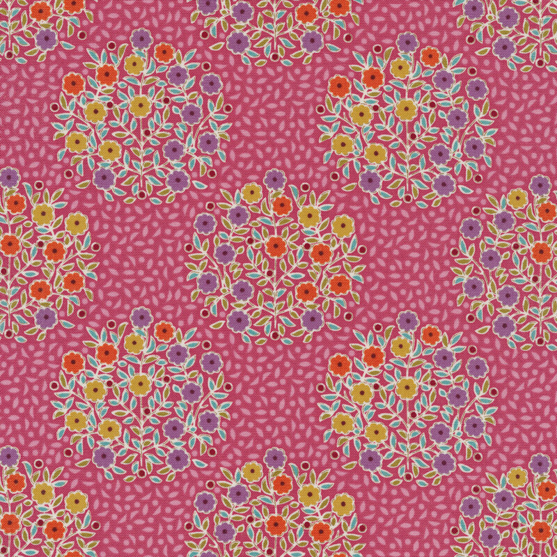 pink fabric with tonal pink leaves and bunches of purple, yellow, and orange flowers with aqua leaves
