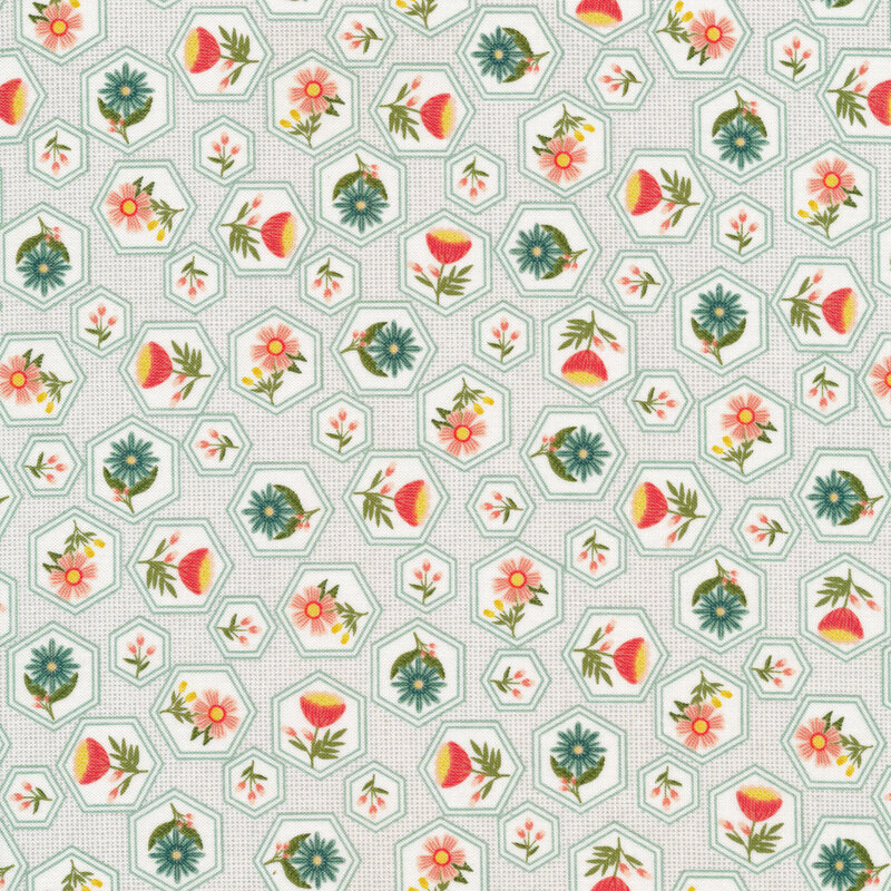 Fabric with bright flowers in hexagons all over a white background