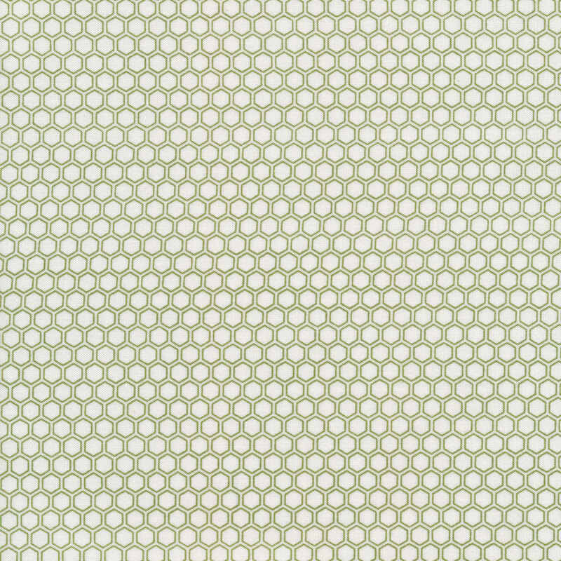White fabric with green hexagon shapes all over