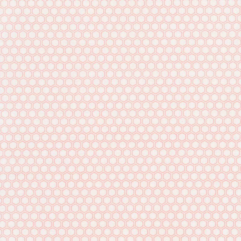 White fabric with pink hexagon shapes all over