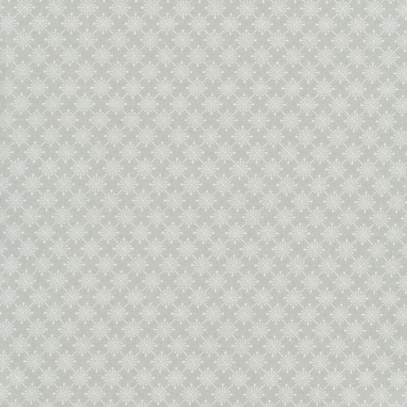 Light gray fabric with diamond shaped stars forming a lattice pattern