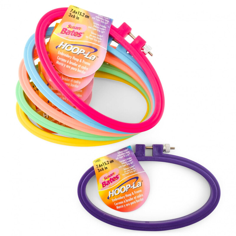 An assortment of colorful Hoop-la embroidery hoops on a white background