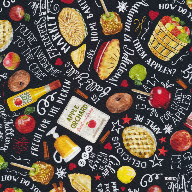 Black fabric with images of autumn food and pie all over with white words.