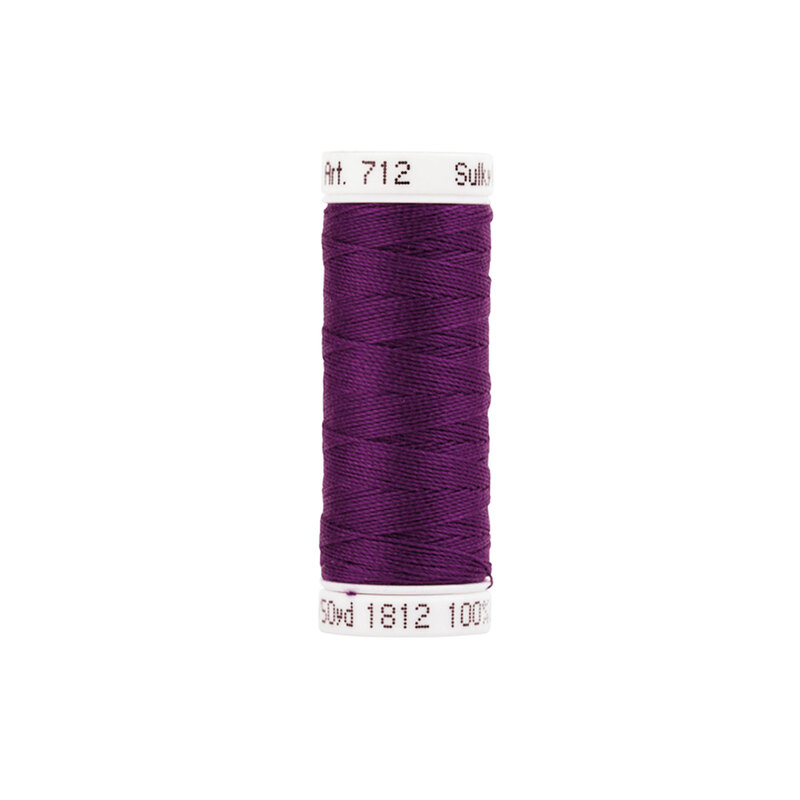 Single isolated spool of dark purple Sulky Petite Cotton thread #1812 Wildflower