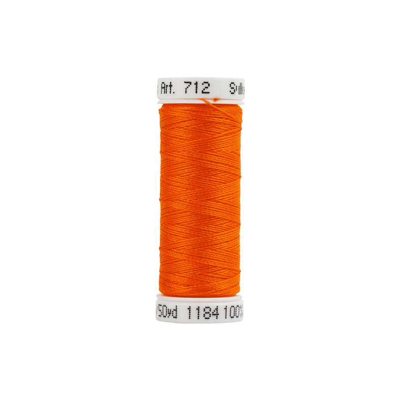 A spool of Sulky 12wt Cotton Petite #1184 Orange Red thread on a white background
