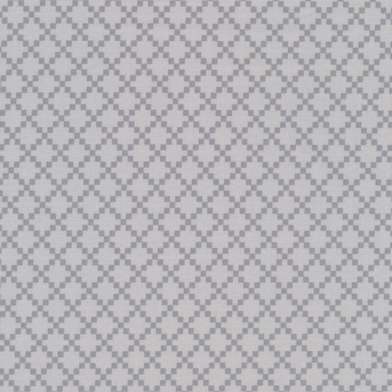 Light gray fabric covered with dark tonal lattice made up of small diamonds