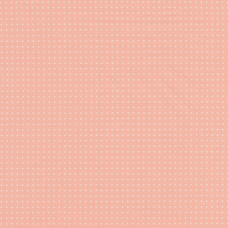 Pink fabric with evenly spaced white pin dots
