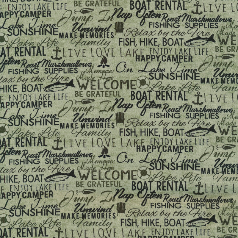 Image of green fabric with words layered all over in green, black, and brown with small motifs