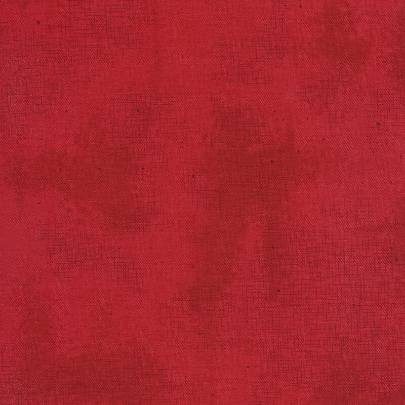 A basic red tonal fabric with crosshatching and mottling