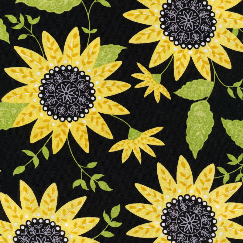 Fabric with large yellow sunflowers with green leaves on a black background