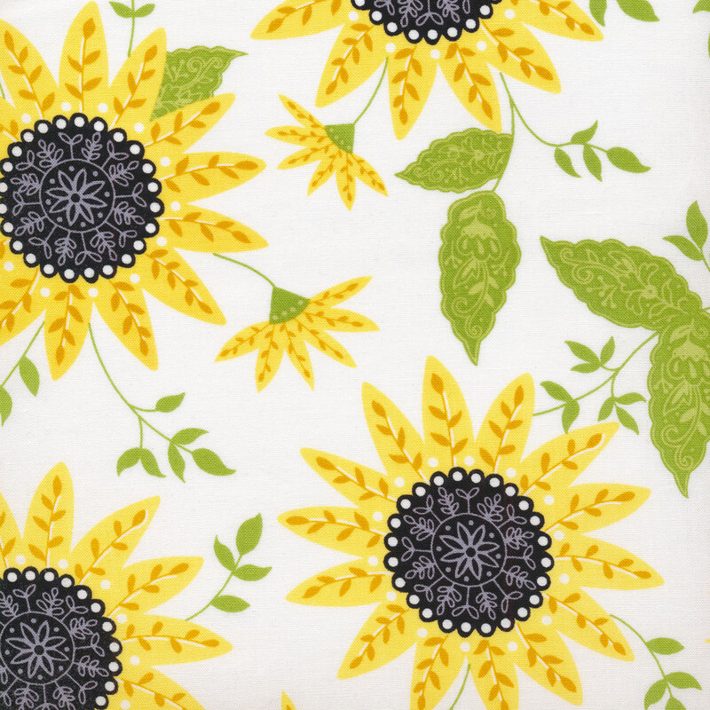 Fabric with large yellow sunflowers with green leaves on a white background