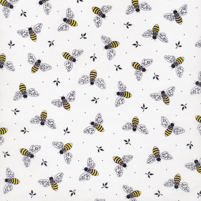 Fabric with yellow bees on white background and small black leaves