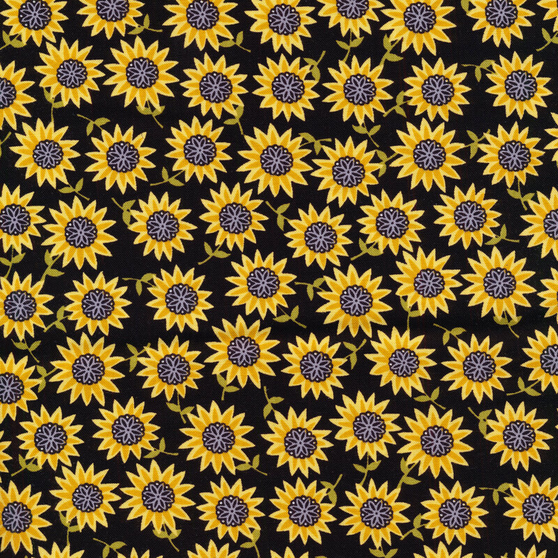 Fabric with sunflowers on a solid black background