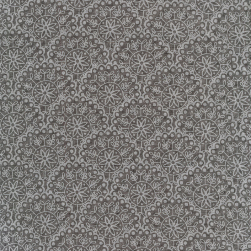 Fabric with grey scallops and light grey flowers and leaves 