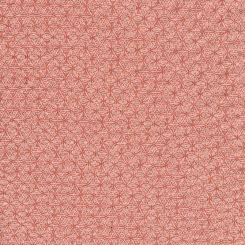 Pink fabric with tiny dark pink flower bursts evenly spaced all over with subtle texture