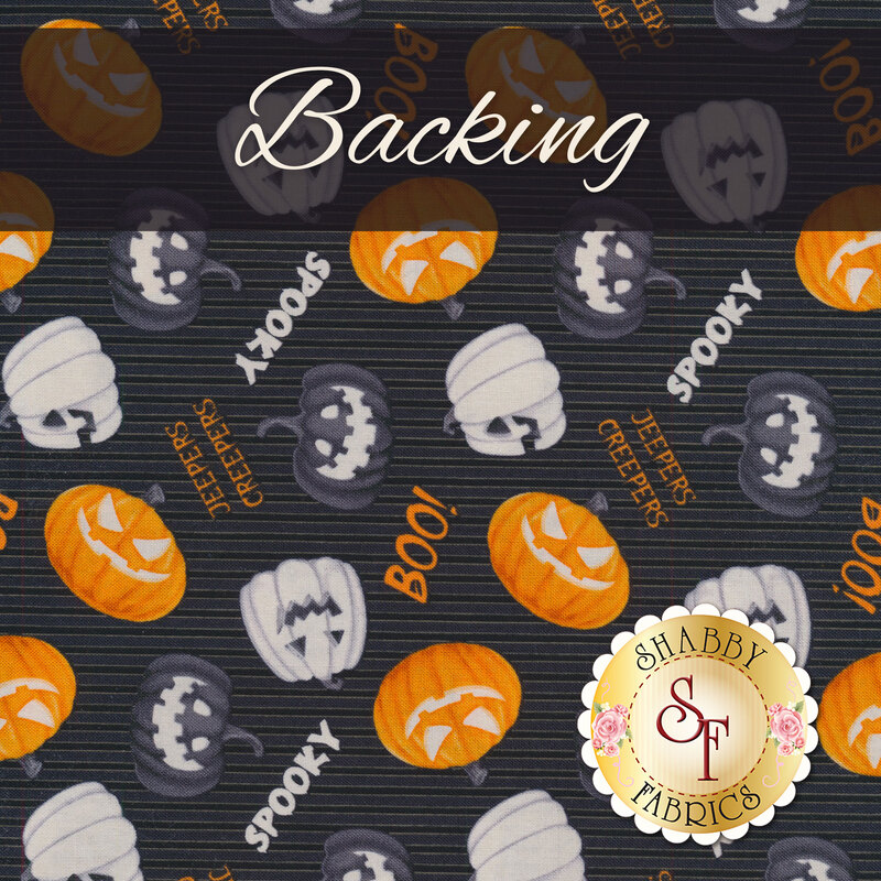 A swatch of black striped fabric with tossed black, white, and orange jack-o-lanterns with spooky Halloween phrases. A black banner at the top reads 